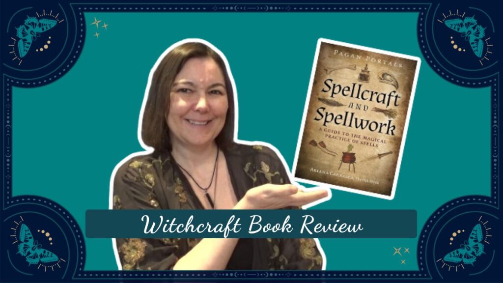 Beverley a white woman is holding her hand up showing the cover of a book called spellcraft and spellwork. She is smiling at the camera